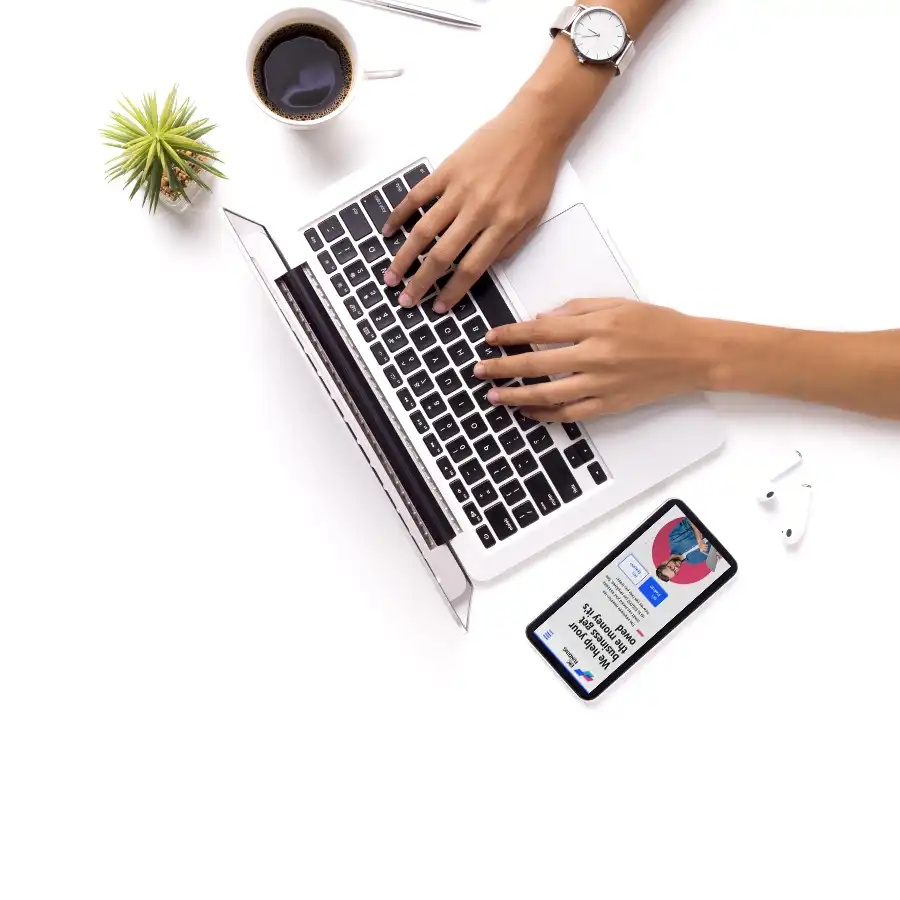 Women hands working on a laptop with a coffee on side