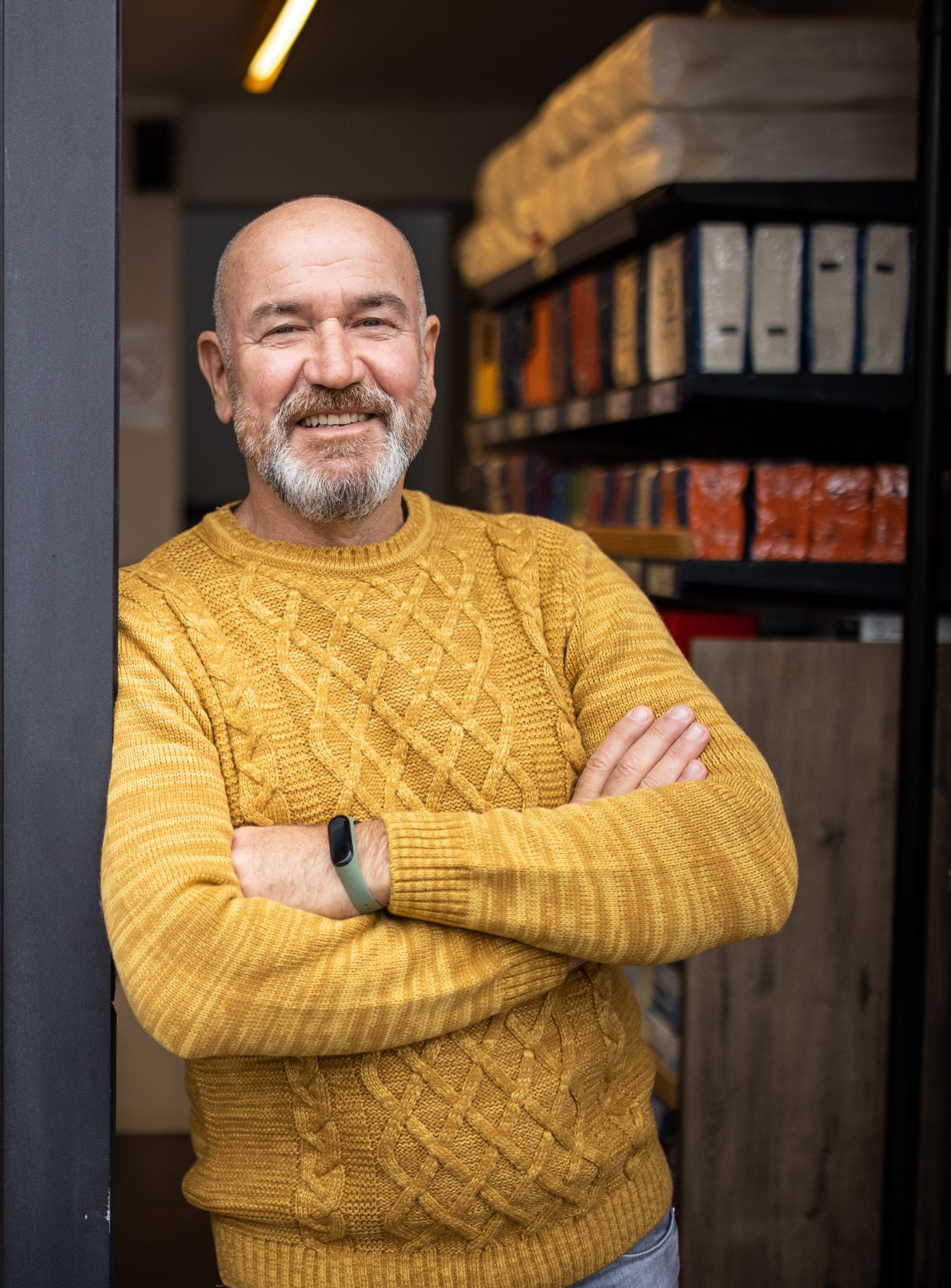 Portrait of proud Caucasian man, a home goods store owner in front of the store